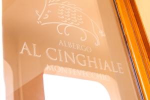 a sign on a door with a bird on it at Albergo Al Cinghiale in Montevecchio