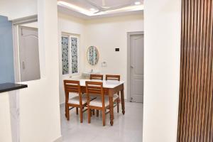 a dining room with a table and chairs at Beach front flat in Bhīmunipatnam