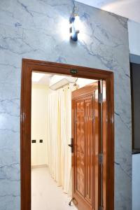 a door in a room with a marble wall at Beach front flat in Bhīmunipatnam