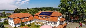 an overhead view of a house with an orange roof at Gasthaus Zur Schleuse Canow in Wustrow
