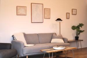 a living room with a couch and a table at Rowan Beg Retreat Lake View Apartment in Renvyle