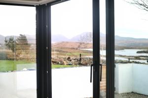a view from the window of a house at Rowan Beg Retreat Lake View Apartment in Renvyle