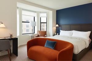 a hotel room with a bed and a chair at The Study at Johns Hopkins in Baltimore +69 photos