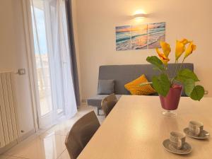 a living room with a table and a couch at Luxury House Gallipoli in Gallipoli