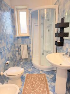 a bathroom with a shower and a toilet and a sink at Luxury House Gallipoli in Gallipoli +32 photos