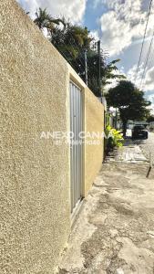 a building with a door on the side of a street at Anexo - Pousada Canaã in Recife
