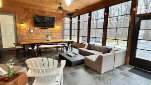 a living room with a couch and a table at Ruffino Retreat in Union Pier