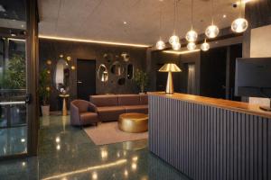 a living room with a couch and a television at Aparthotel Montcada in Montcada i Reixac
