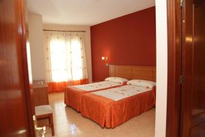 Postel nebo postele na pokoji v ubytování Hotel Ciudad Pozo Alcón