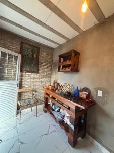 a room with a wooden table in a room at Chalé Florada d' Serra in Chapada dos Guimarães