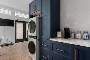 a kitchen with a washing machine in a blue cabinet at Spacious w/ 2BR 2Bath - Big Bear in Big Bear City