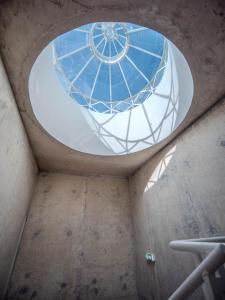 a round window in a building with a glass ceiling at Padrão 319 - Touristic Apartments in Porto +58 photos