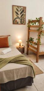a bedroom with a bed and a ladder at Garden JP in João Pessoa +29 photos