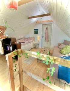 a small room with a bed and a couch at Bohemian accommodation in a magical idyll! in Simrishamn