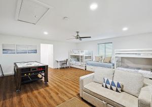 a living room with a couch and a bed at Lake Granbury House, Sleeps 11 with Lake Access! in Granbury +15 photos