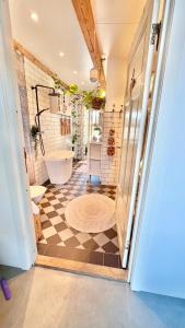 a bathroom with a toilet and a tub in a room at Bohemian accommodation in a magical idyll! in Simrishamn +54 photos