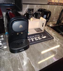 a coffee maker sitting on top of a counter at Appartement thème cinéma in Cazouls-lès-Béziers +8 photos