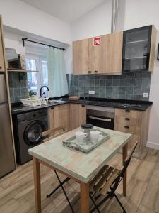 a kitchen with a table with two bowls on it at Casinhas da Ajuda nº13 in Lisbon