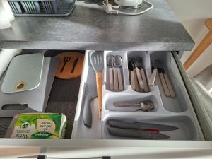 a drawer filled with utensils in a kitchen at Mieszkanko w centrum in Lidzbark Warmiński