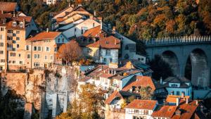 a view of a town with a bridge and buildings at GAMA Home in Fribourg
