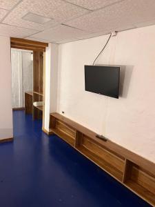 a room with a flat screen tv on a wall at Aloha.ayampe in Ayampe +27 photos