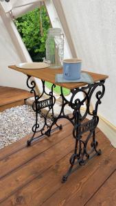 a table with a cup on top of it at glamping podtrosky in Troskovice