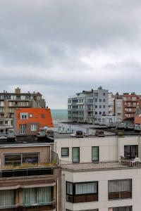 a city with buildings and the ocean in the background at Casiola - Nice apartment close to the beach with parking in Nieuwpoort