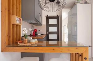 a kitchen with a glass counter top in a room at Las Arenas in Costa Calma