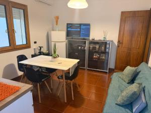 a living room with a table and a tv at max piedigrotta in Pizzo