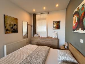 a bedroom with a bed and a window in it at NOAR Enjoy Your Stay in Orešje