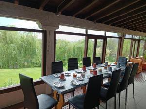 a dining room with a large table and chairs at Surf House Gerra in San Vicente de la Barquera