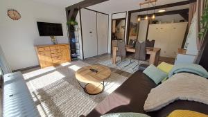 a living room with a couch and a table at Ferienwohnung Schäfer in Siegsdorf