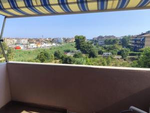 a balcony with a view of a city at Casa Turistica Andora in Marina di Andora
