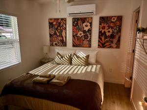 a bedroom with a bed with two towels on it at Golden Sol Casita in Tempe
