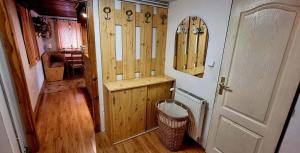 a room with a wooden door and a hallway at Chalupa Špičák in Jablonec nad Nisou