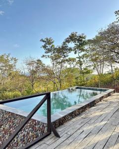 a swimming pool on the deck of a house at Altos de Santa Catalina in Soná +17 photos