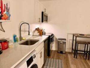 a kitchen with a sink and a counter top at Azure Casita in Tempe +3 photos