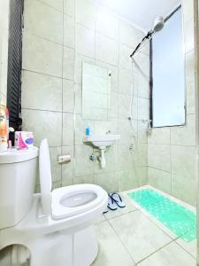 a bathroom with a toilet and a sink and a shower at Neriah Paradise in Gatunga +9 photos