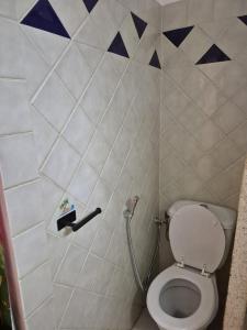 a small bathroom with a toilet in a room at Studio Samba in Saly Portudal +19 photos