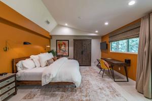 a bedroom with a large bed and a desk at Paso Paradiso in Paso Robles +67 photos