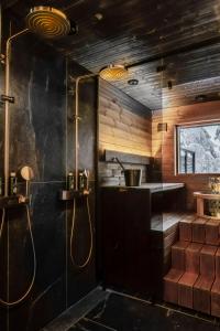 a bathroom with a shower and a sink at Iisakki Village in Ruka +186 photos