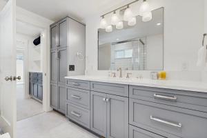 a bathroom with a sink and a large mirror at Library House in Durango +29 photos
