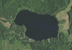 an aerial view of a lake in a field at Gresham Shores - Lil' Sunfish - PET FRIENDLY in Arbor Vitae