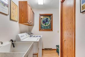 a kitchen with a sink and a counter top at Loonsight in Minocqua
