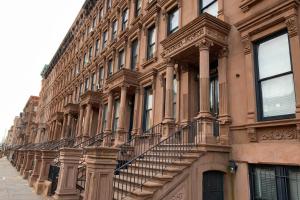 a building with stairs on the side of it at Plush & Spacious 2-Bedroom in NYC in New York