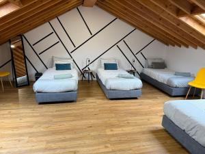 a room with three beds in a attic at B&C Furnas House in Furnas +66 photos