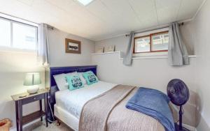 a small bedroom with a bed and a window at Lilly Pad Landing in Hazelhurst