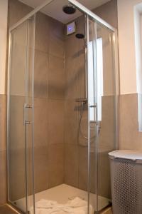 a shower with a glass door in a bathroom at Apartments-Altenahr in Altenahr