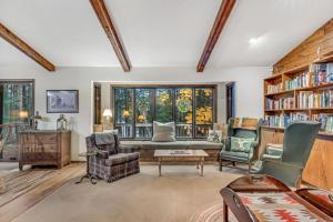 a living room filled with furniture and a large window at Loonsight in Minocqua +40 photos