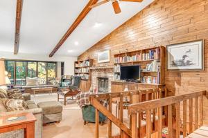 a living room with a brick wall at Loonsight in Minocqua